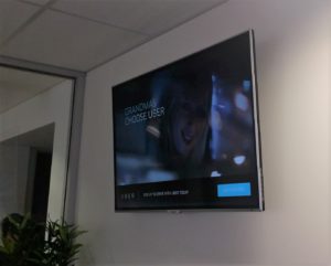 large tv mounted on a wall