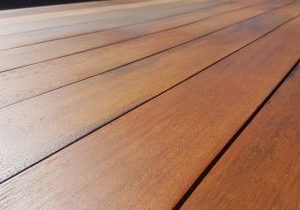 Expanse of timber that has been treated with oil to rejuvinate the surface on this outdoor table